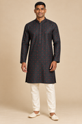 Charcoal Black Semi-Cotton Kurta with Red Motifs – front view on a model, with small red geometric motifs scattered across the charcoal fabric