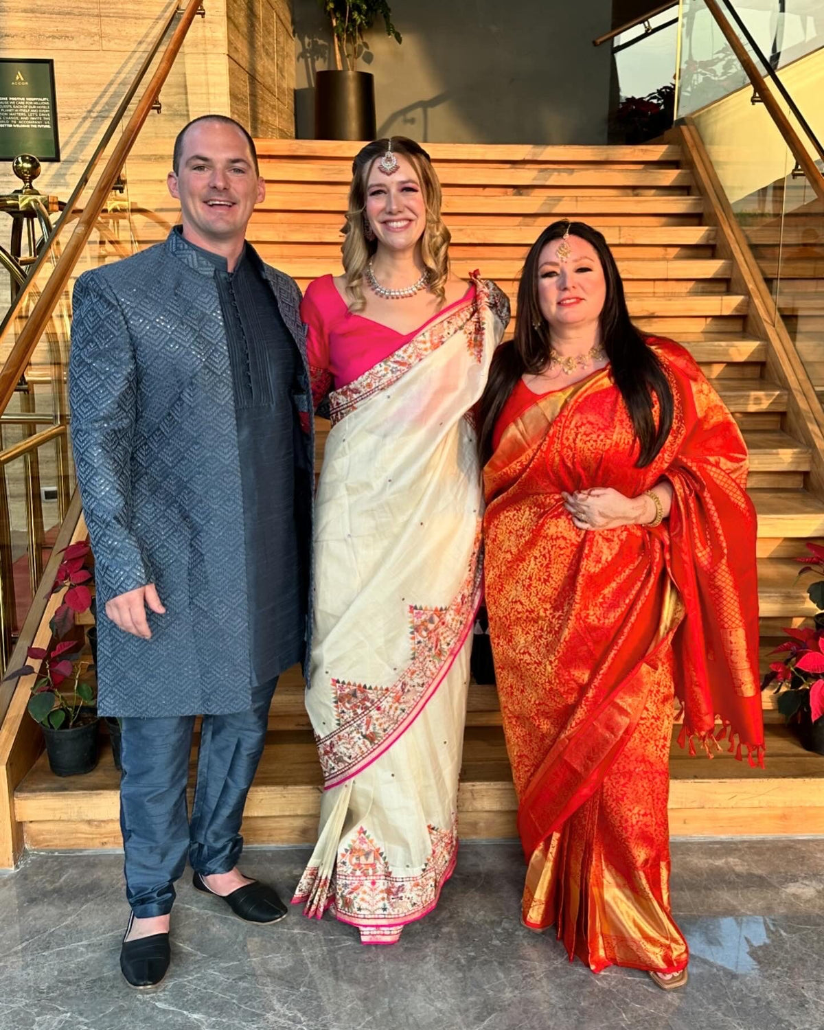 Family dressed in silk sarees for a celebration