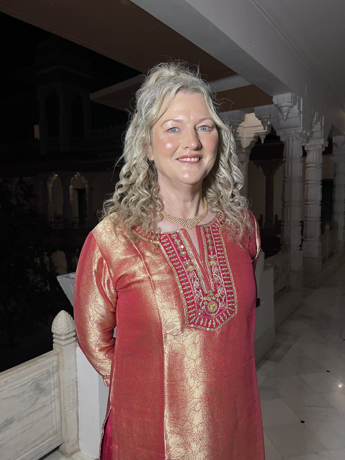 Customer in a red and gold kurta set